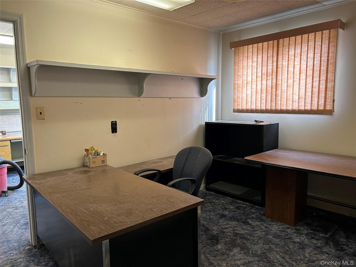 Office featuring dark carpet