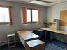 Unfurnished office with a baseboard radiator