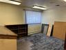 Unfurnished office featuring a baseboard heating unit