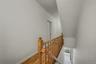 Stairs with baseboards and wood finished floors