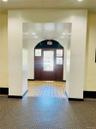 Entrance foyer with light tile patterned floors, baseboards, arched walkways, and recessed lighting