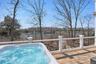 Water views of the wide open creek from the hot tub on the expansive upper level deck