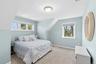 Guest bedroom with plenty of windows and natural light