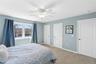 Guest bedroom featuring multiple closets