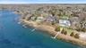 Drone/aerial view of the incredible waterfront setting with deepwater dock for two boats