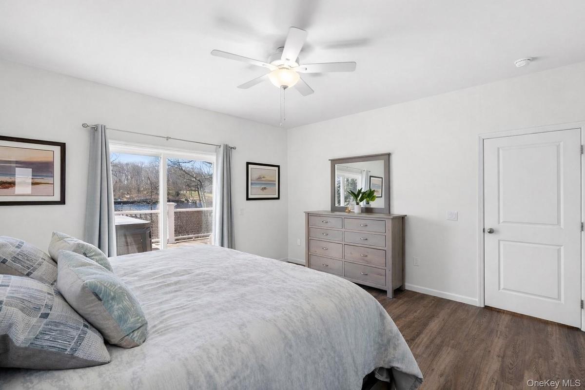 Primary ensuite with large walk in closets and access to balcony