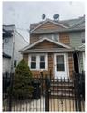 View of front of home with a gate and a fenced front yard. More photos to come!