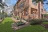 View of side of property featuring brick siding