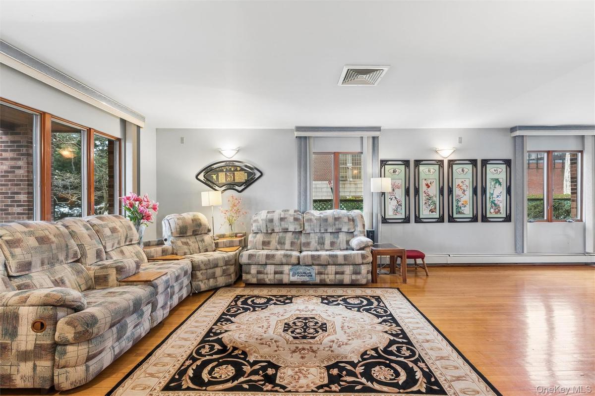 Living area featuring plenty of natural light and wood finished floors