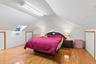 2nd Guest Bedroom featuring light wood-type flooring and a skylight