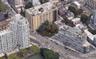 Aerial view of property's location featuring property parcel outlined and nearby urban area