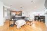 Living room featuring light wood finished floors and recessed lighting