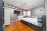 Bedroom with baseboards and wood finished floors