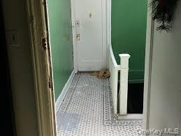 Doorway to outside featuring tile patterned floors