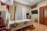 Bedroom featuring wood finished floors and a closet