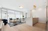 Living area featuring light wood-style floors and baseboards
