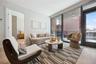 Living room with light wood finished floors and plenty of natural light