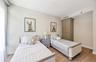 Bedroom featuring light wood-style floors and baseboards