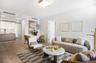 Living room featuring light wood finished floors, baseboards, and recessed lighting