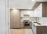 Kitchen with appliances with stainless steel finishes, a sink, modern cabinets, and recessed lighting