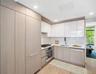 Kitchen featuring a sink, stainless steel appliances, light wood-style floors, light countertops, and recessed lighting