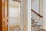 Integrated home elevator featuring panel molding, recessed lighting, and patterned flooring