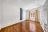 Empty room featuring lofted ceiling, hardwood / wood-style flooring, and recessed lighting
