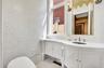 Bathroom with vanity and light tile patterned floors