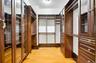 Walk in closet with light wood finished floors