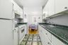Long line updated kitchen w matching appliances flows into the dining area