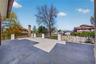 View of patio with a residential view and a gate