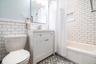 Updated bathroom with subway tiles and bathing tub