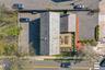 12 ON-SITE PARKING SPACES. 8 Rear Lot and 4 Front Lot. View of the overhead ROOFTOP TERRACE.