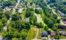 View of property location with nearby suburban area