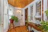 Sunroom / solarium featuring radiator heating unit