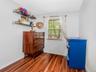 Apt 2 - Bedroom featuring wood finished floors and baseboards