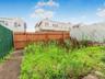 View of fenced backyard