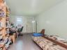 Tiled bedroom featuring a desk and cooling unit