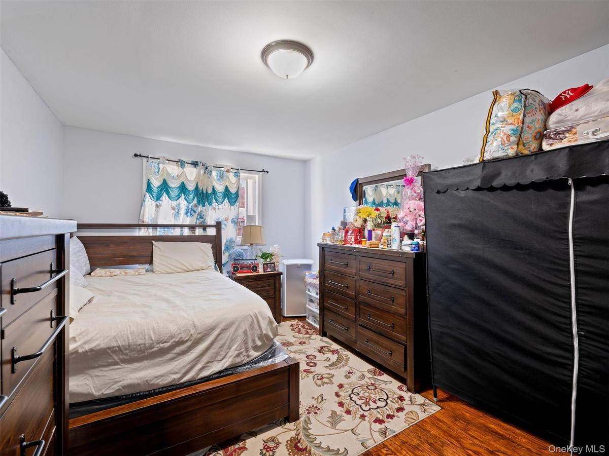 The room features light-colored walls and hardwood flooring