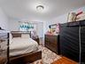 The room features light-colored walls and hardwood flooring