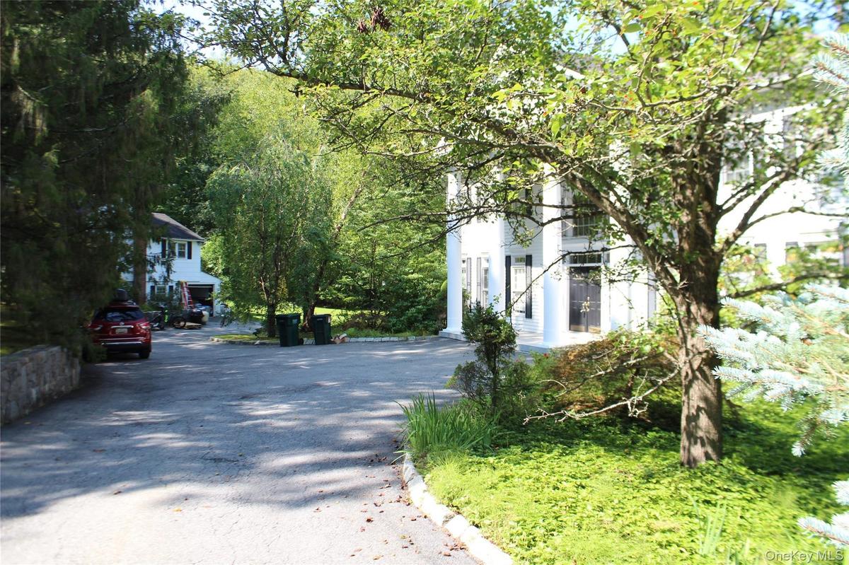 View of house and cottage beyond.