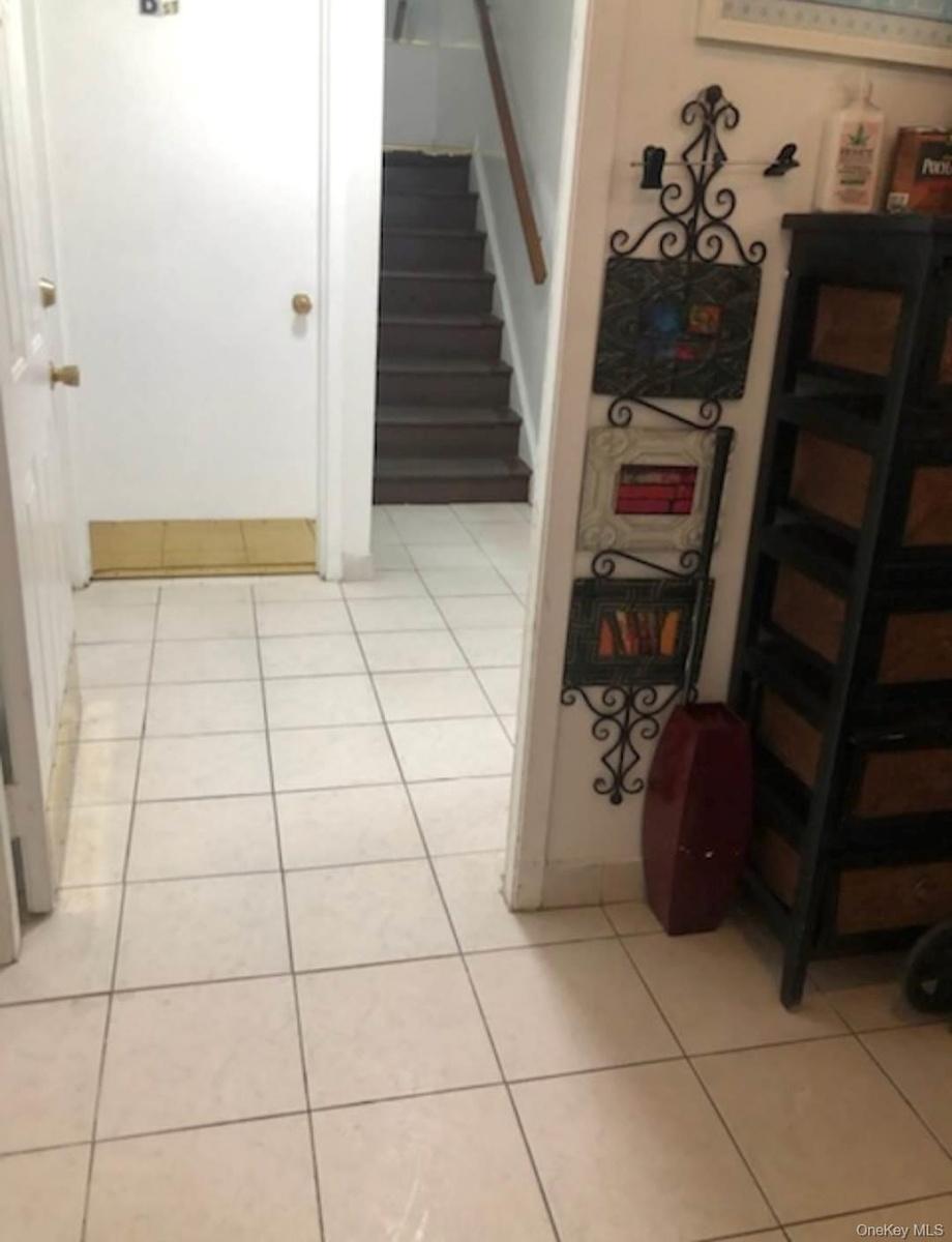 Stairway featuring tile patterned flooring