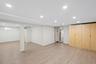 Expansive room featuring recessed lighting, light wood-look flooring.