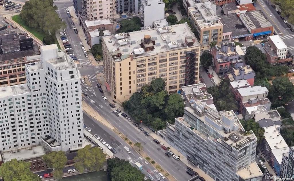 Aerial view of property's location with nearby urban area