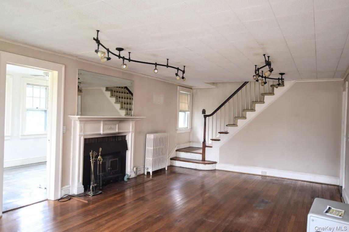 Fireplace and gorgeous wood floors,