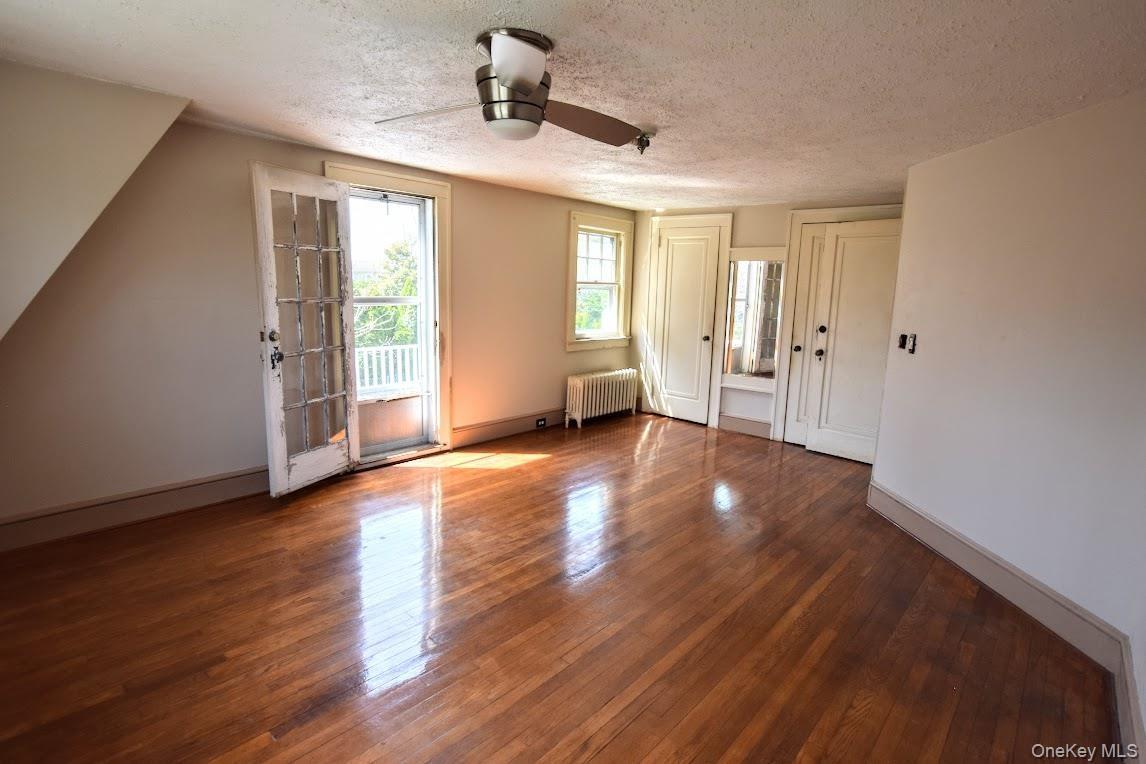 Bedroom with walk-out balcony.