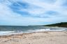 Sandy shoreline with rolling waves and sweeping LI Sound views, capturing the natural beauty of the coastline just below the bluff