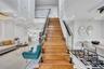 Stairway featuring wainscoting, a decorative wall, and recessed lighting