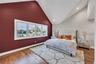 Bedroom featuring recessed lighting, high vaulted ceiling, wood finished floors, and baseboards