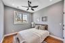 Bedroom with baseboards, wood finished floors, visible vents, and recessed lighting